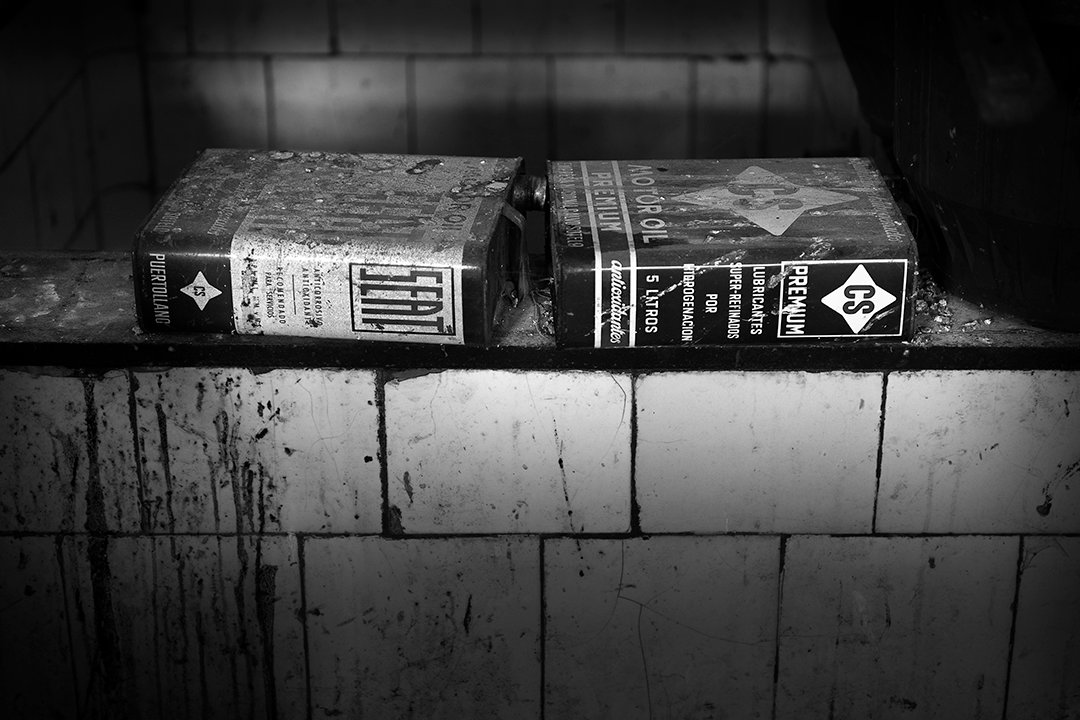 Two boxes on a tiled ledge.